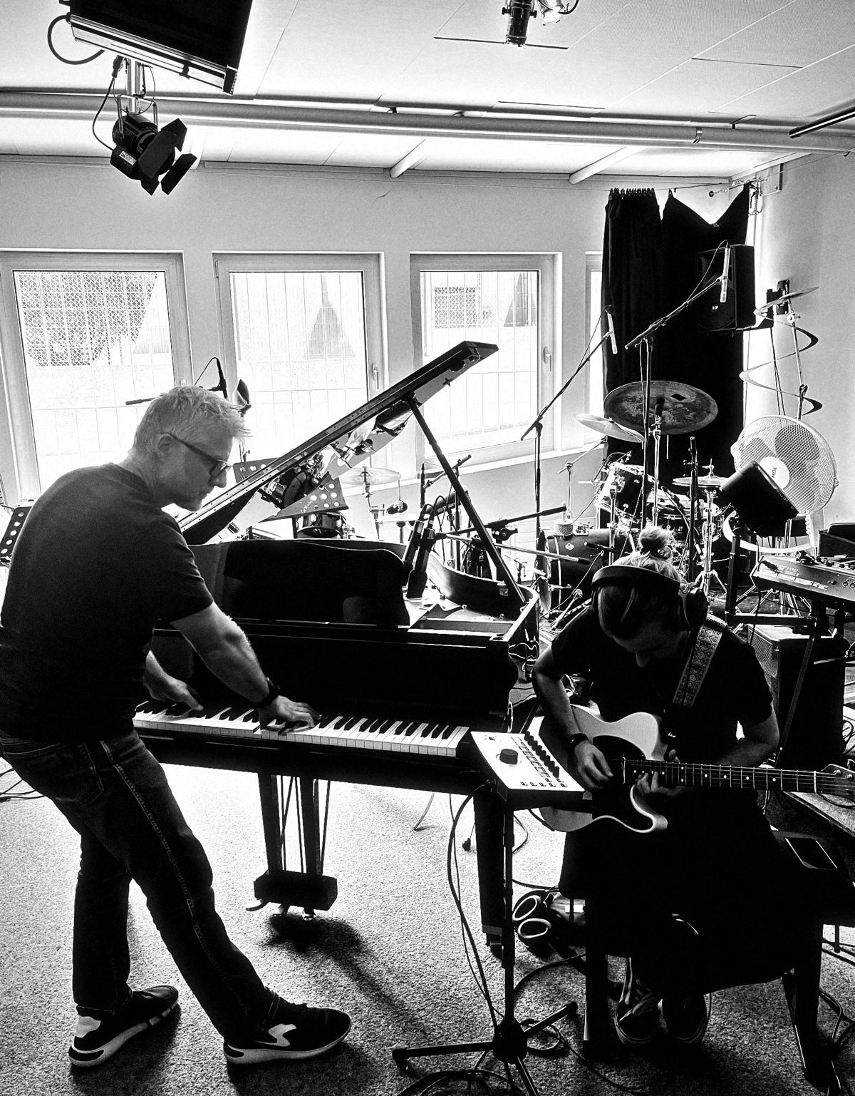 Phil at the grand piano during a session